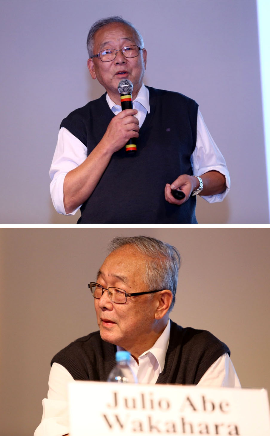 #PraCegoVer - Descrição da imagem para cegos: a foto mostra um senhor vestindo uma camisa branca, um colete preto e óculos de grau. Ele está em pé e segurando um microfone numa mão e o controle na outra, ele parece estar discursando; a segunda foto mostra o mesmo senhor sentado numa mesa. À frente dele está uma garrafa de água e uma placa com o nome “Julio Abe Wakahara”.